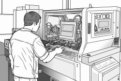 a machinist standing at a cnc machine inputting a program